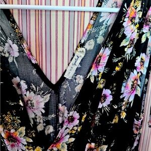 Black and floral dress with plunging neckline, and side slits. Date night dress!